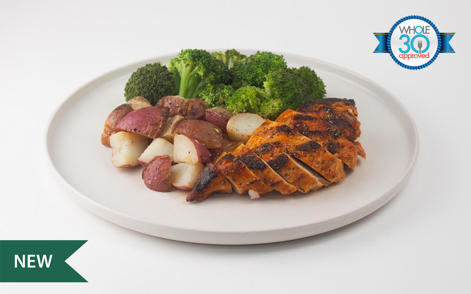 A Zesty hot lemon pepper chicken paired with red skinned potatoes and broccoli 