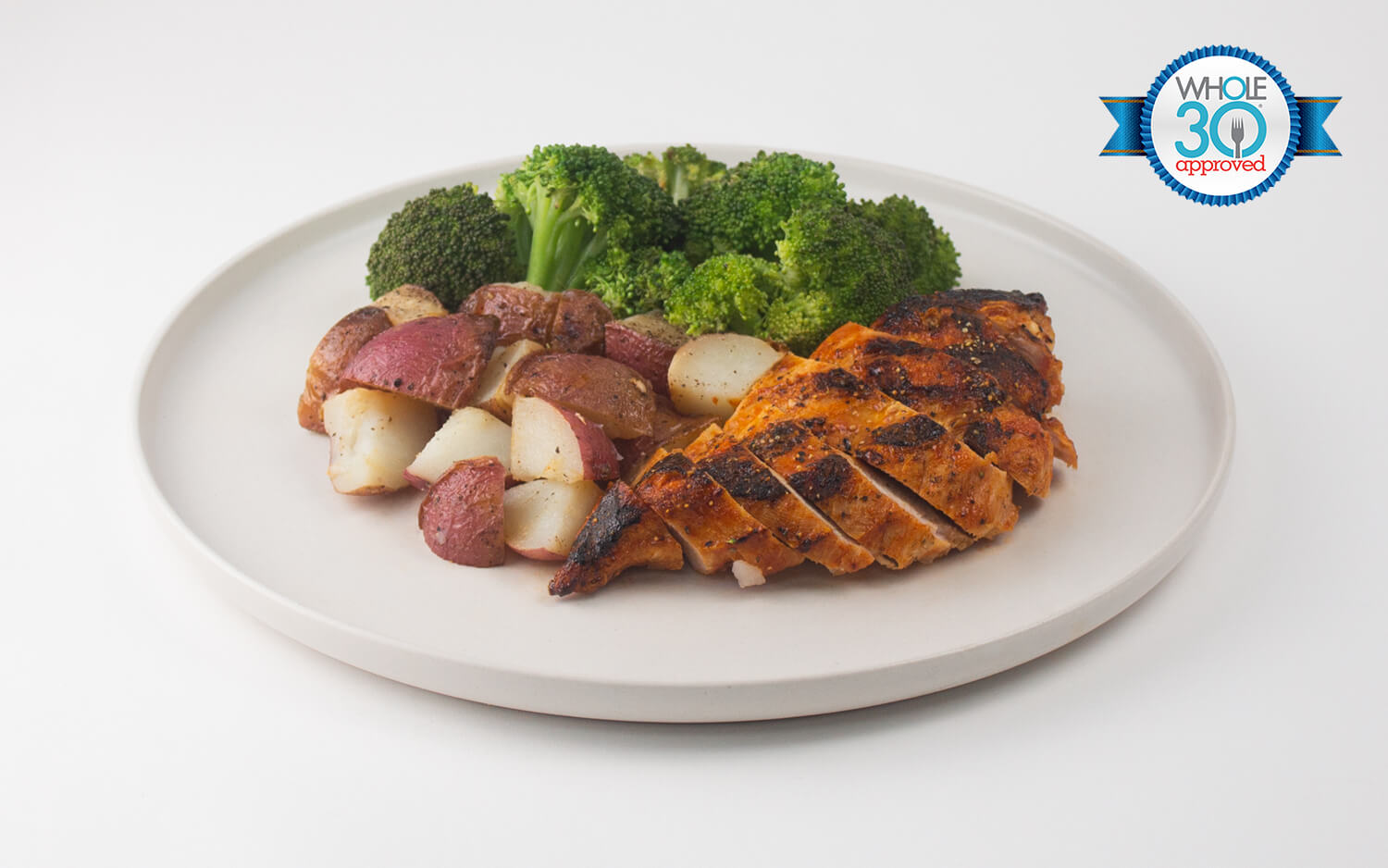 A Zesty hot lemon pepper chicken paired with red skinned potatoes and broccoli 