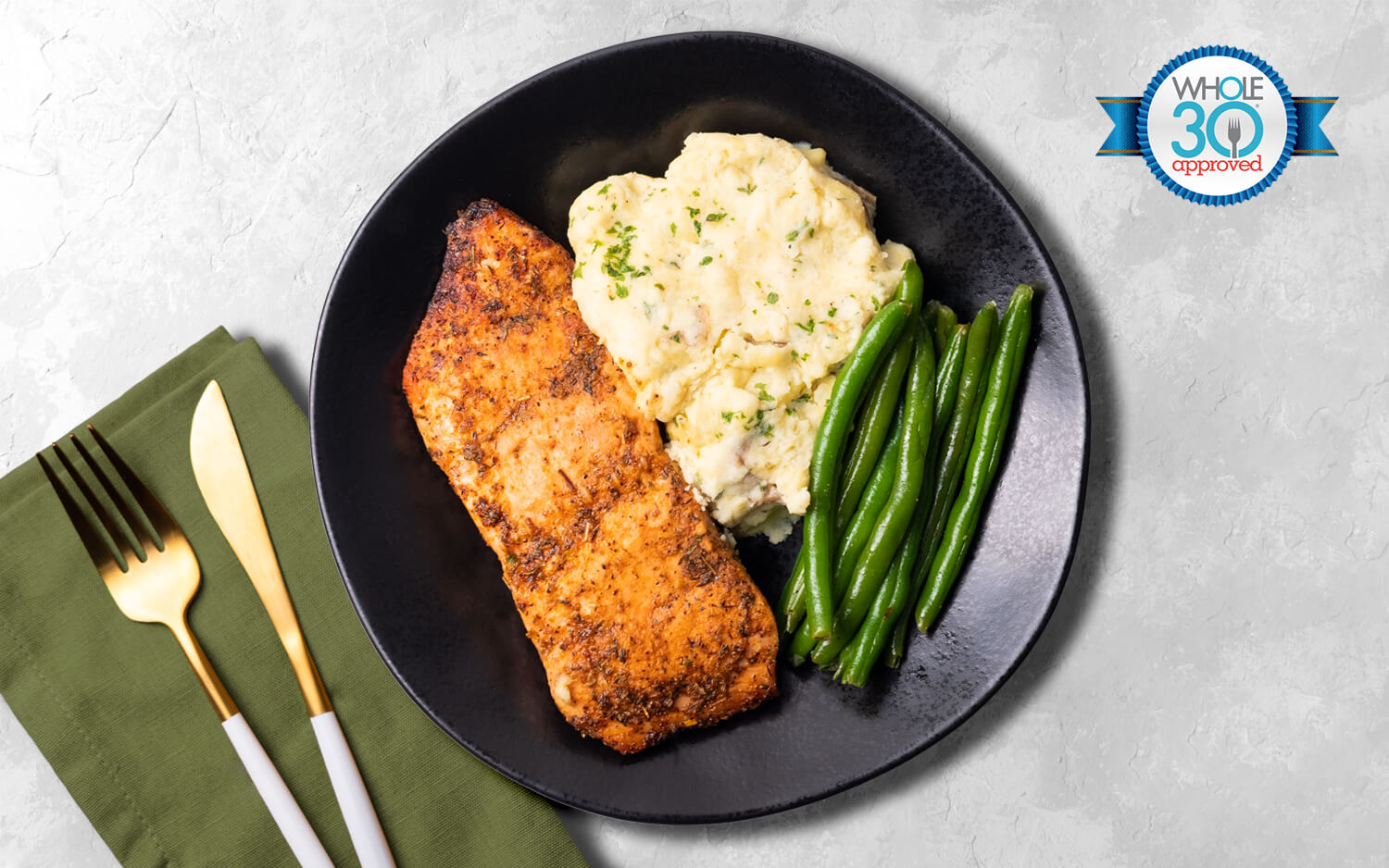 Cajun seasoned salmon served with green beans and red-skin mashed potatoes. 