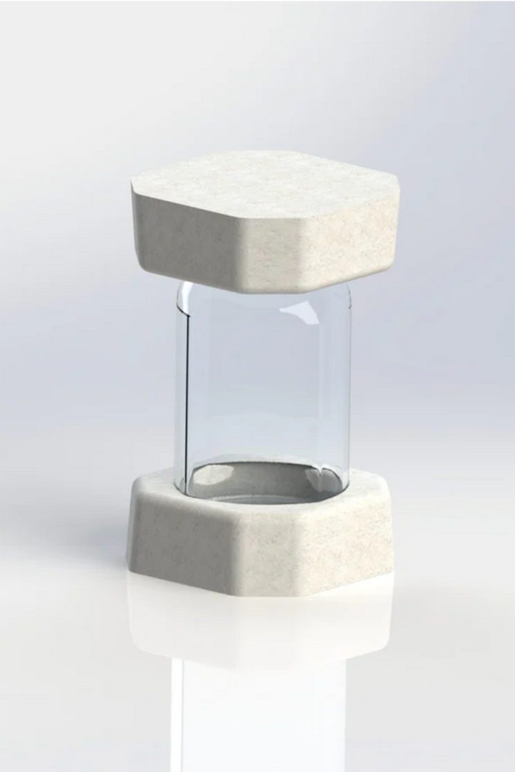 a mason jar protected with mushroom based packaging on the top and bottom
