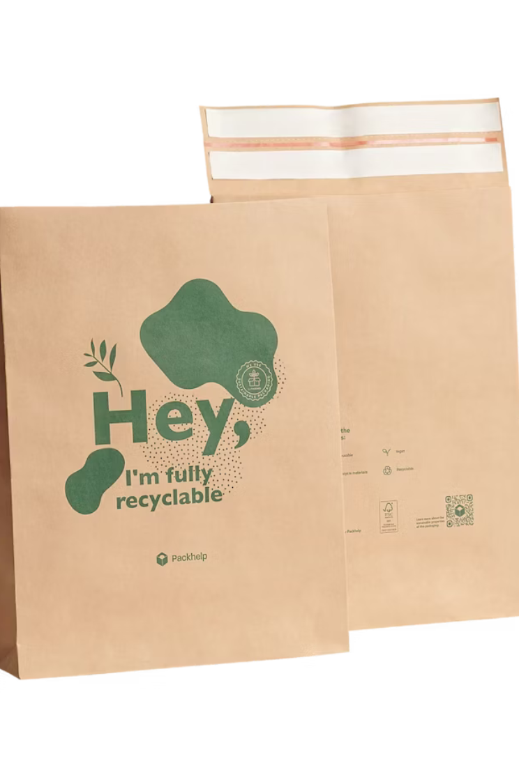 a paper recyclable mailer with green accents and words that read "hey, i'm fully recyclable."