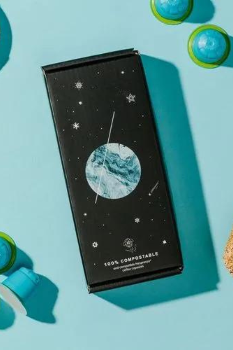 a long rectangular box decorated with stars and a globe, the words at the bottom read "100% compostable"