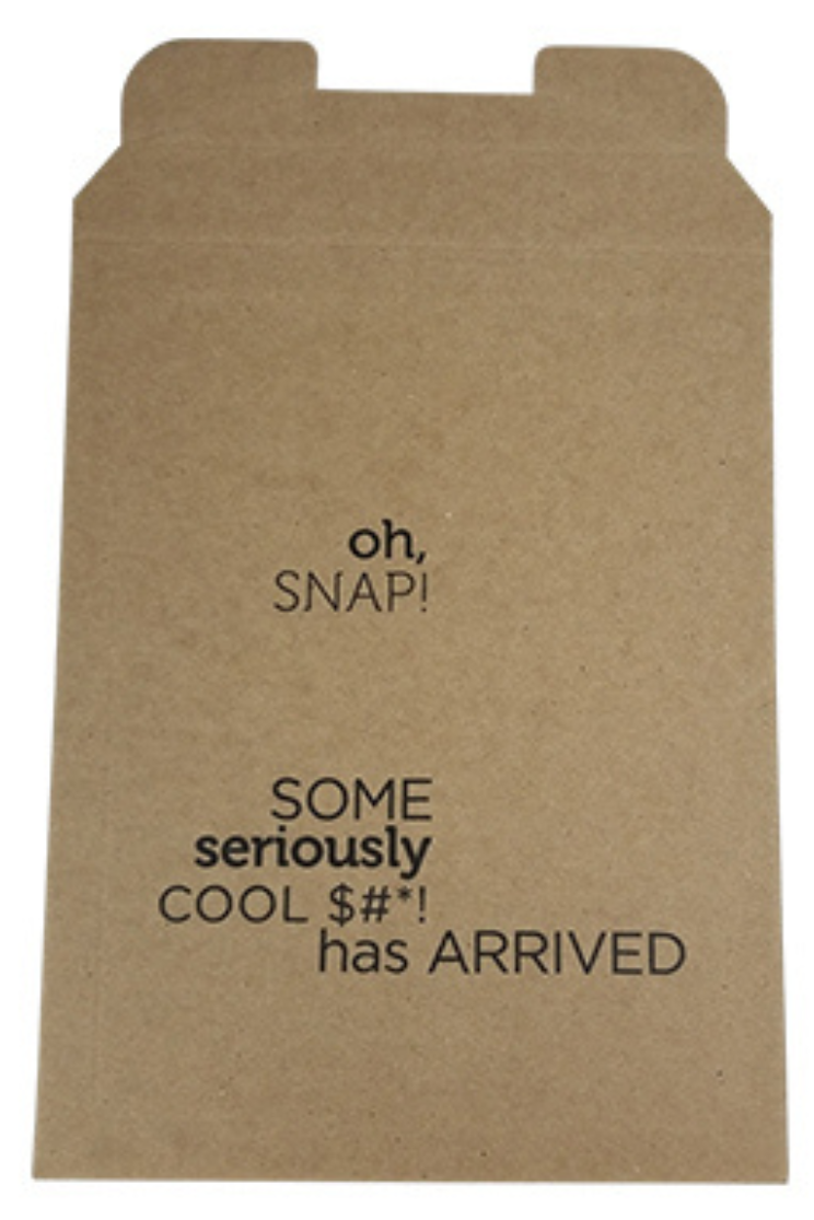 a brown paper mailer with tabs and the words "oh snap! some seriously cool $#*! has ARRIVED
