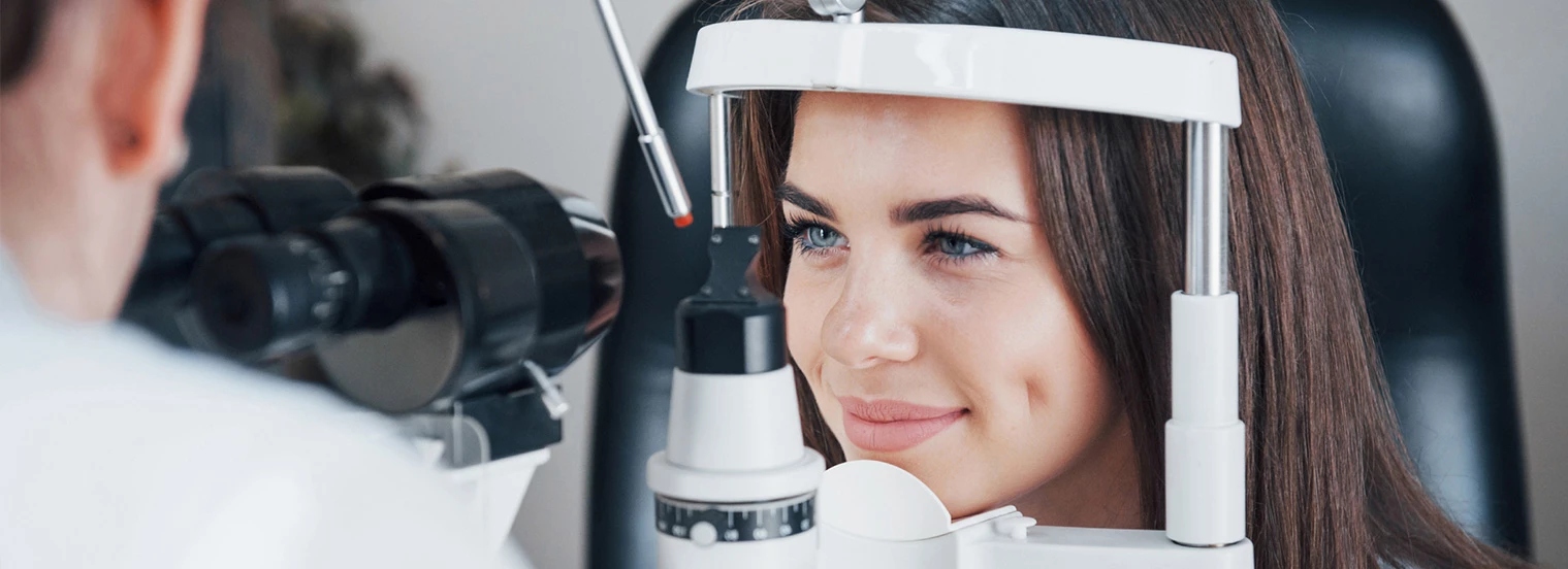 A woman receives an eye exam.