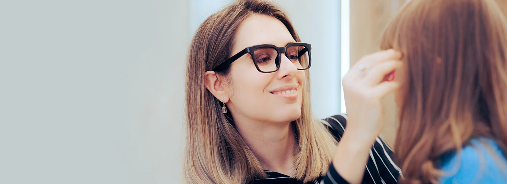 Family getting fitted for glasses.