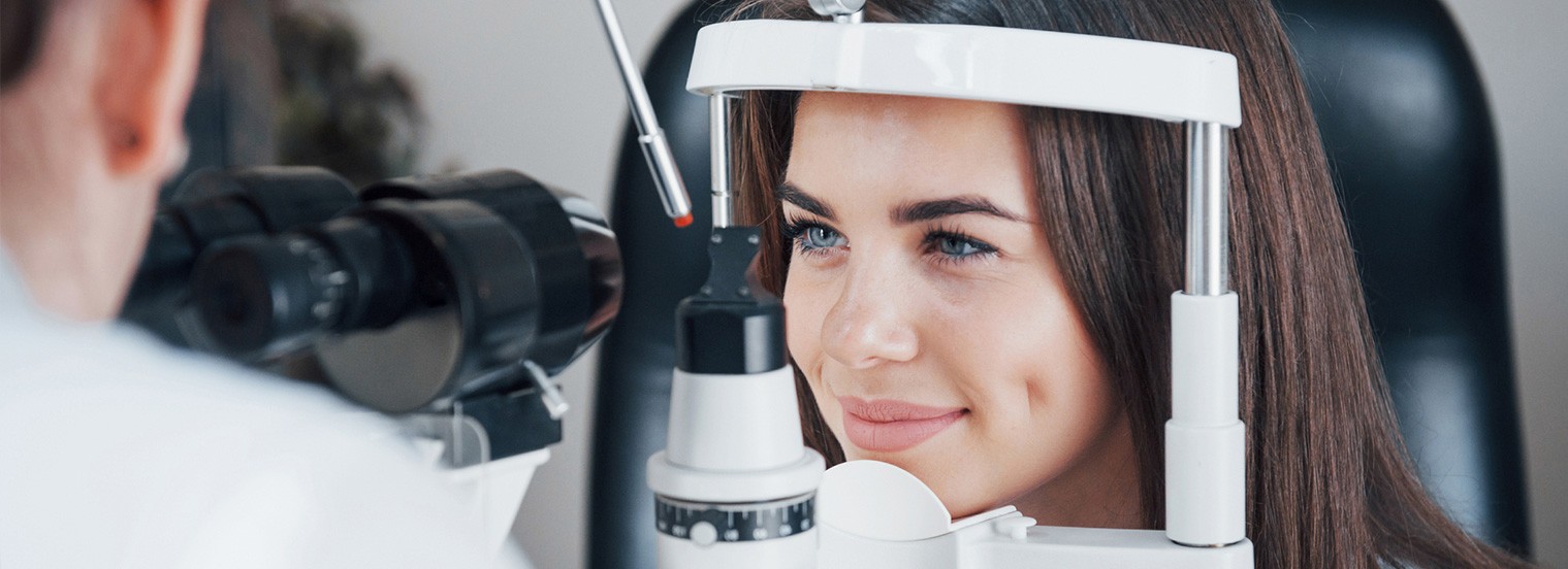 Young female with eye doctor during eye exam.