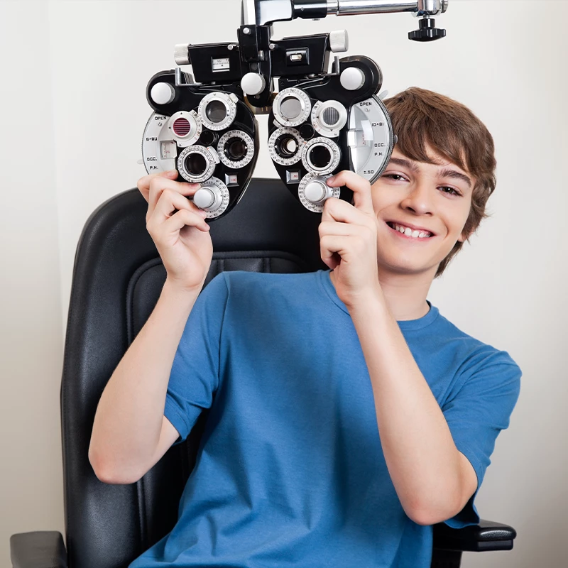 A young teen undergoing an eye test at the optometrist.