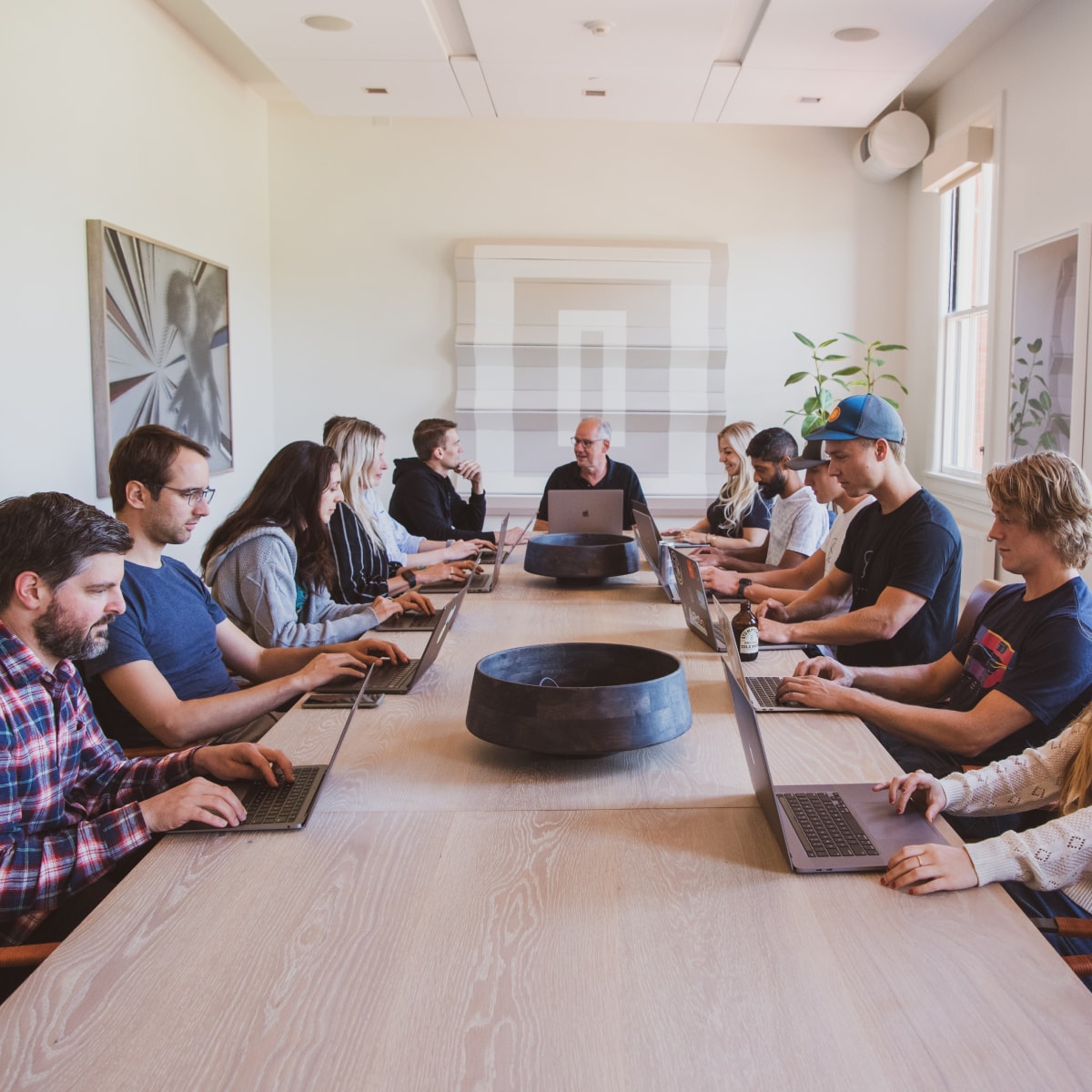 A group of people around a meeting table