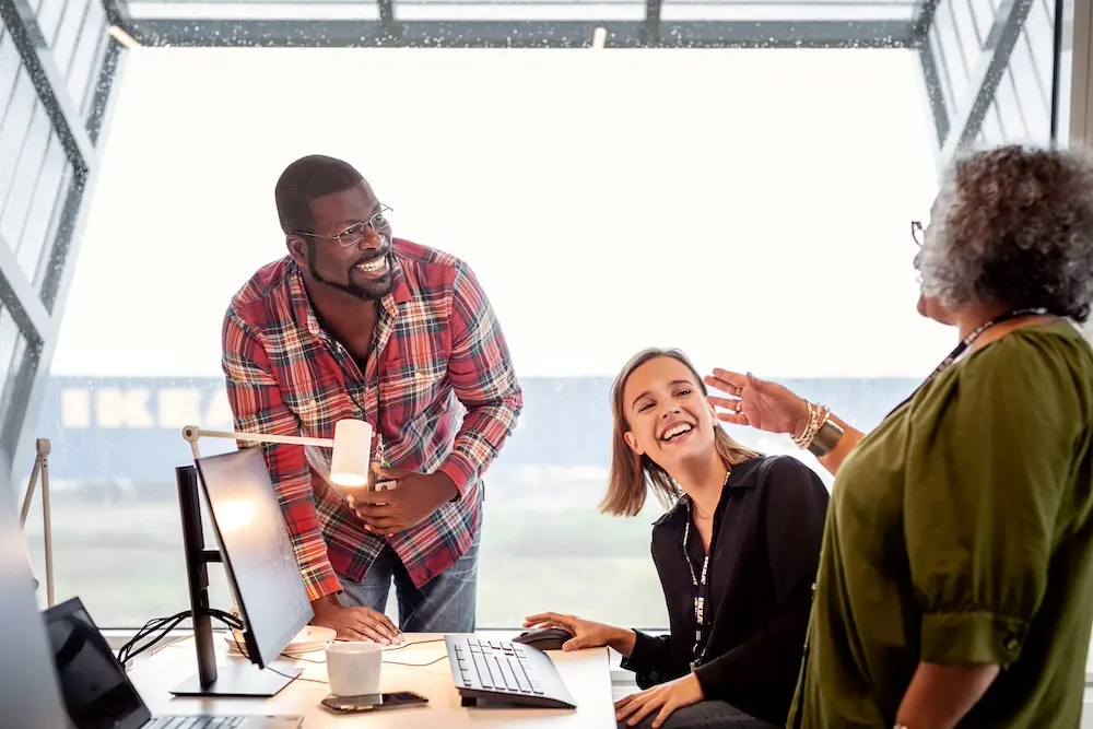 People laughing in an office setting