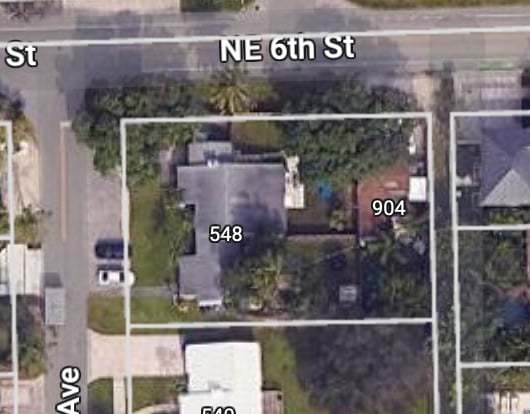 Satellite map of a corner lot with an existing house