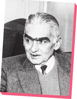 Imagem de Monteiro Lobato. Ele tem cabelos grisalhos, sobrancelhas grossas e usa um terno.