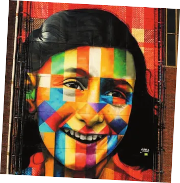 Imagem de painel que retrata uma menina sorrindo. O rosto dela contém diversos retângulos coloridos.