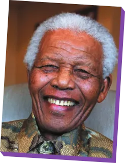 Imagem de Nelson Mandela. Ele é idoso e está sorrindo.