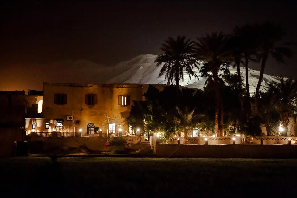 The Marsam at night, adobe walls and lantern light on Luxor's West Bank.