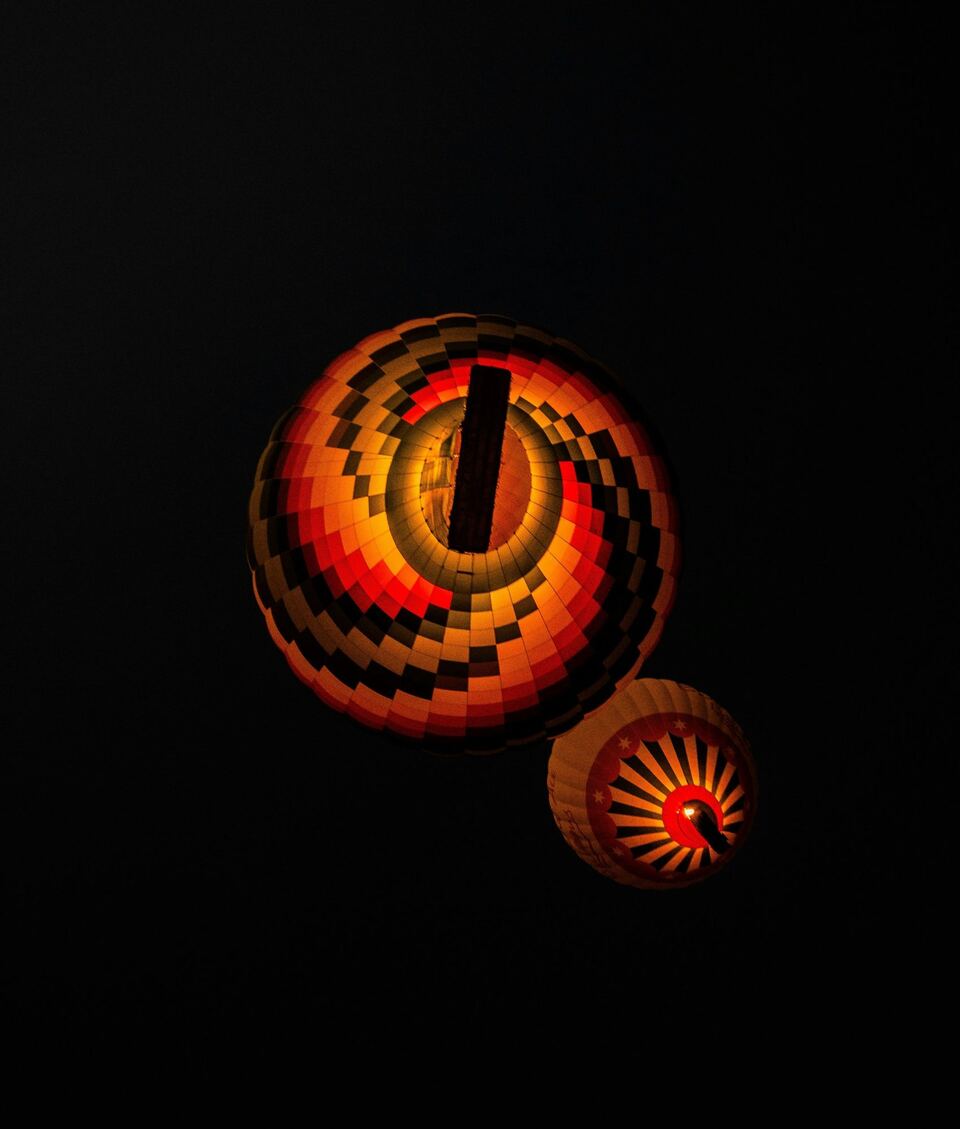 Balloons lit before dawn. Photo: Michael Starkie