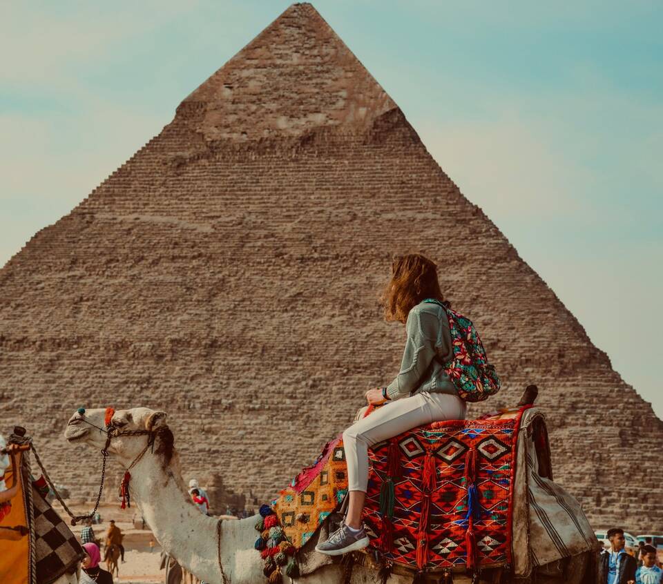 A traveller on a camel before the Pyramid of Khafre. Photo: Ahmed Hashish