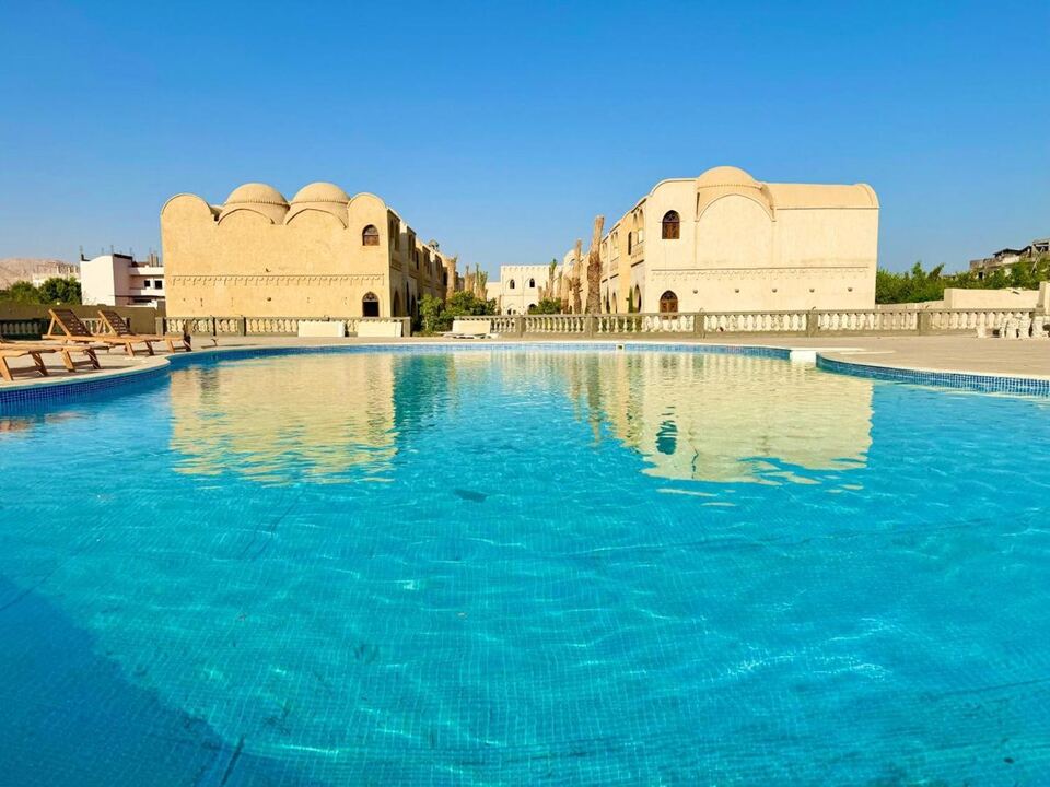 The pool between the apartment buildings