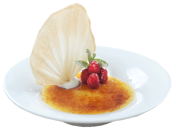 bowl of creme brulee with raspberries and wafer sticking out from the top.