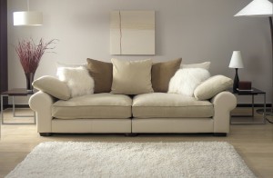 cream sofa in modern living room with rug