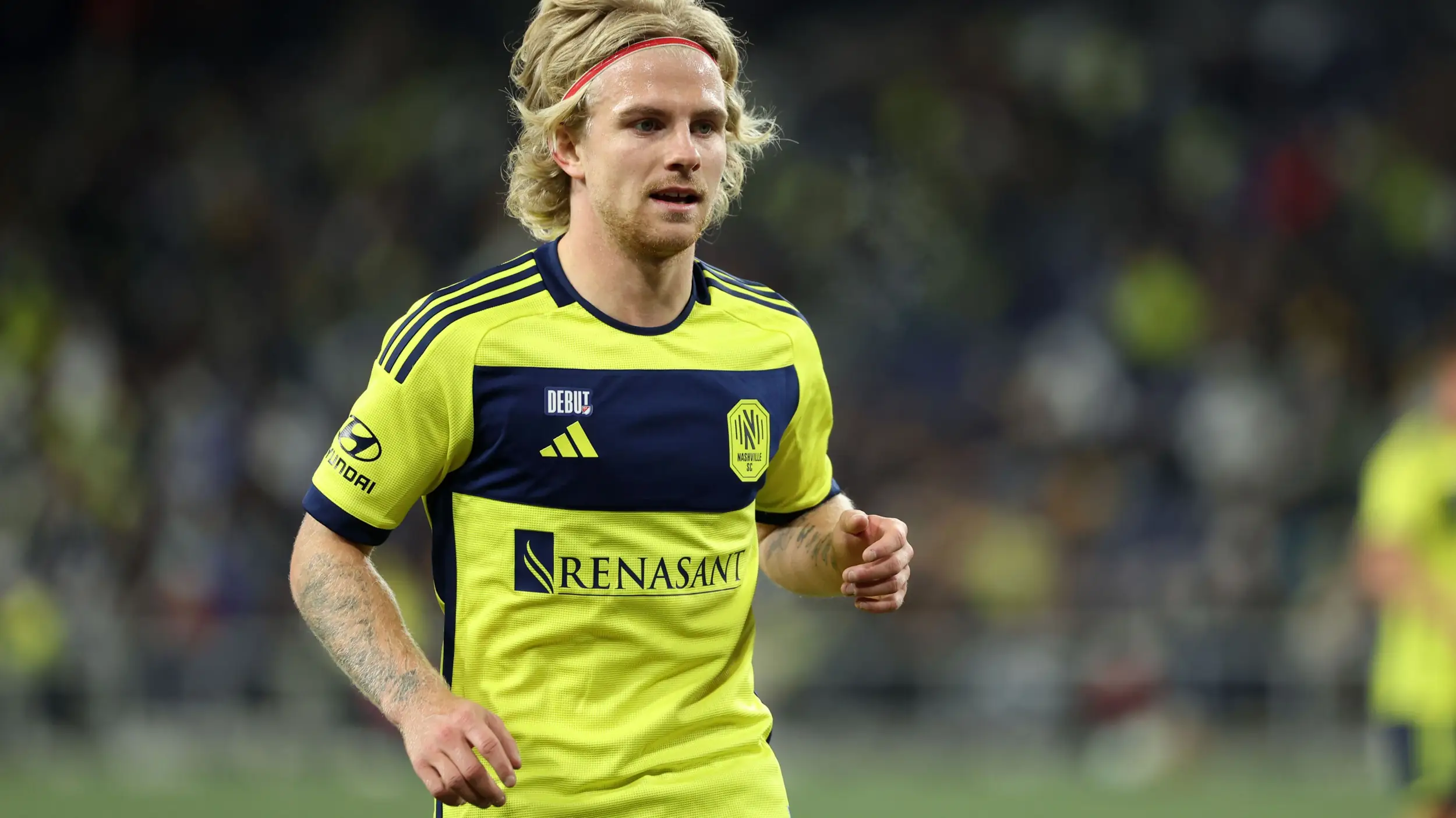 Nashville SC star and Pokémon fan Edvard Tagseth exchanges his jersey for Rayquaza card