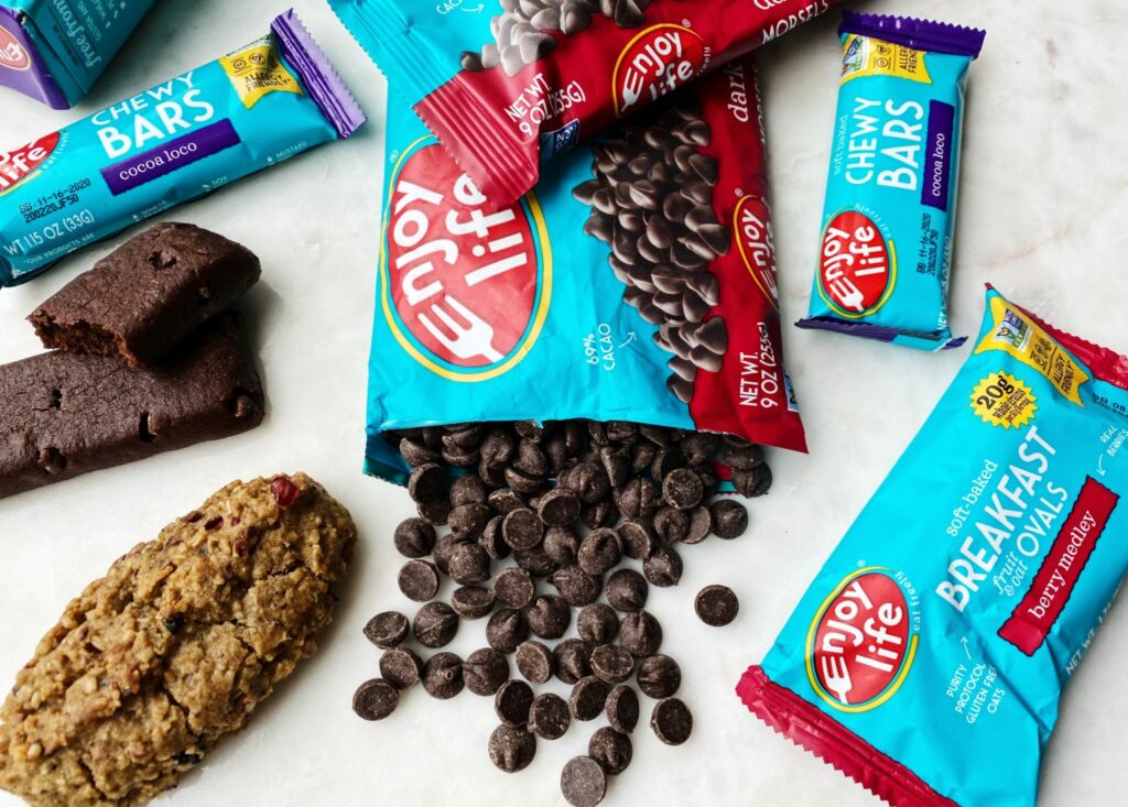 Low FODMAP foods from Enjoy Life include Cocoa Loco Bars, Dark Chocolate Morsels, and Berry Medley Breakfast Ovals