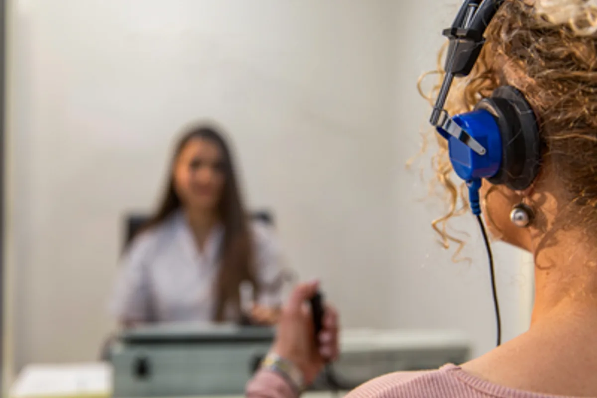 woman taking a hearing test