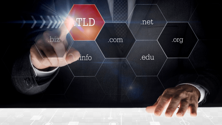 image of a man in a suit touching a screen that has different TLDs on it