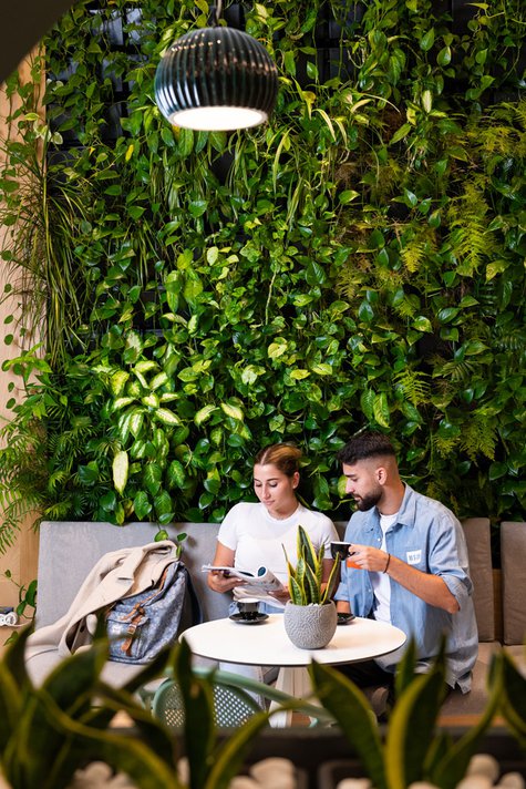 A couple drinking coffee at Enattica Suites