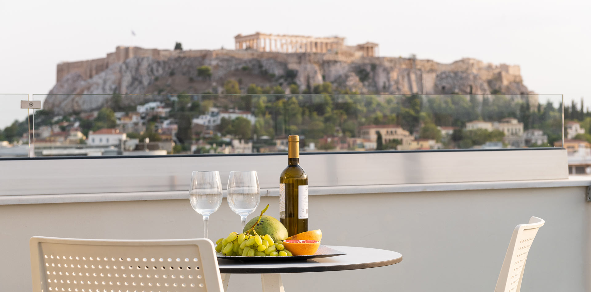 Enattica Suites, Glasses and a bottle of wine with Acropolis view