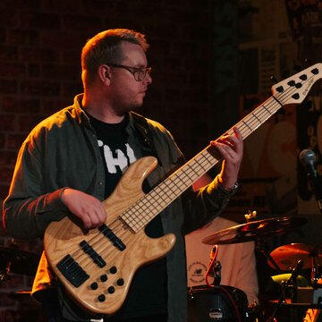 Hire Phillip Court Bass guitarist with Encore