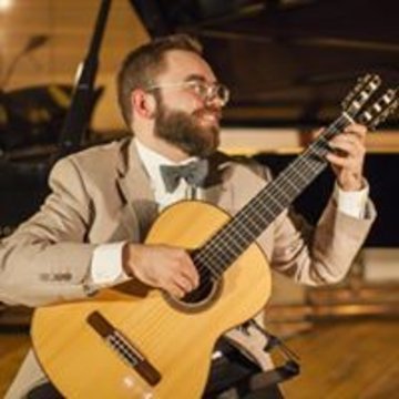 Hire Tiago Gomes Classical guitarist with Encore