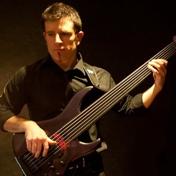 Hire Simon Brewin Bass guitarist with Encore