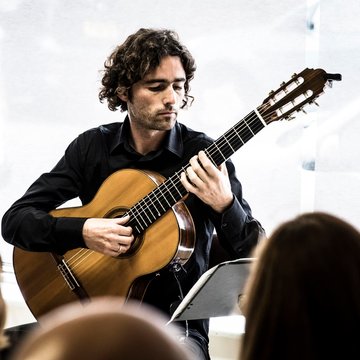 Hire Gerard Cousins Classical guitarist with Encore