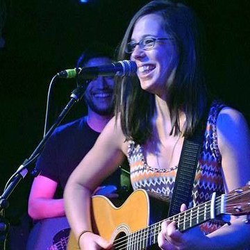 Hire Sara Robalo Singing guitarist with Encore