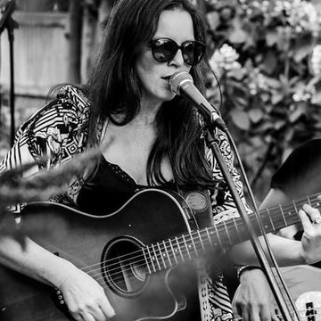 Hire Lisa Kwei Singing guitarist with Encore