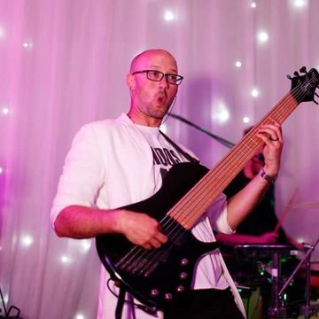 Hire Peter Delf Bass guitarist with Encore