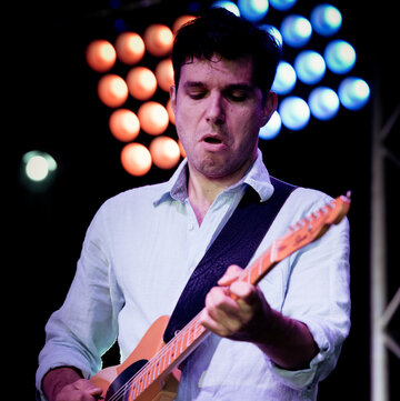 Hire Stefanos Tsourelis Guitarist with Encore