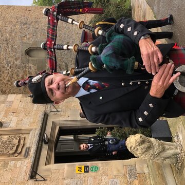 Hire Cameron Edgar Bagpiper with Encore