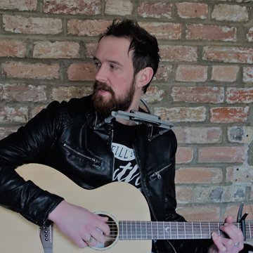 Hire Christopher Law Singing guitarist with Encore