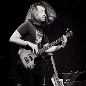 Hire Christian Vieyra Bass guitarist with Encore