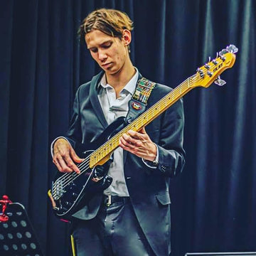 Hire George Comber Bass guitarist with Encore
