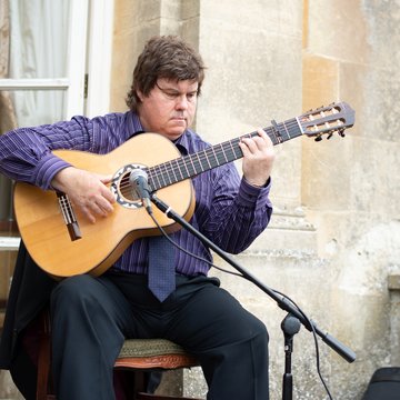 Hire Tomas Jimenez Classical guitarist with Encore