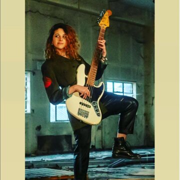 Hire Vittoria Bass guitarist with Encore