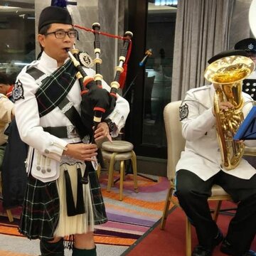 Hire Jacky Ming Bagpiper with Encore