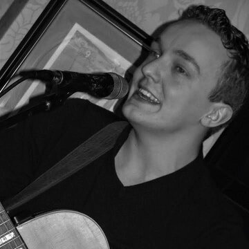 Hire Tom Cayton Singing guitarist with Encore