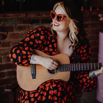 Hire Lily Kerbey Singing guitarist with Encore