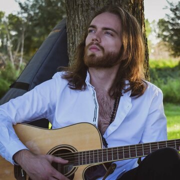 Hire Elliot Rose Singing guitarist with Encore