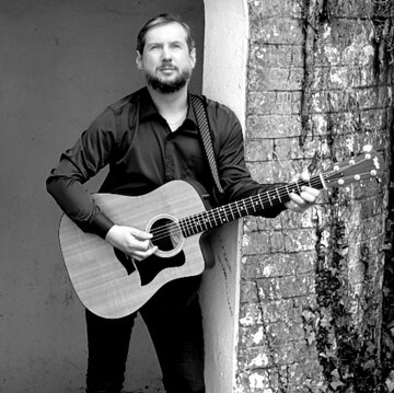 Hire Martin Paul Cuthew Singing guitarist with Encore