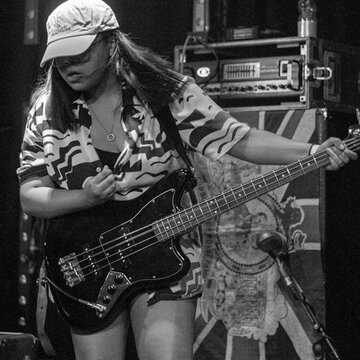 Hire Louisa McClure Bass guitarist with Encore