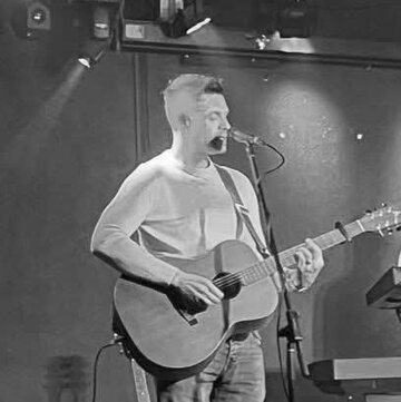 Hire Phil Hulse Singing guitarist with Encore